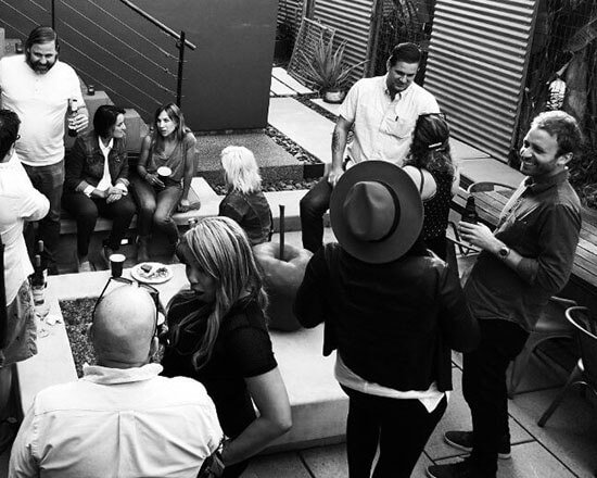 Large group of screenwriters at a networking party