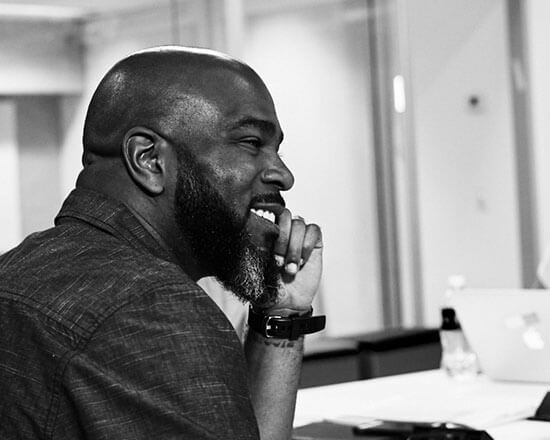 Smiling screenwriting student in class
