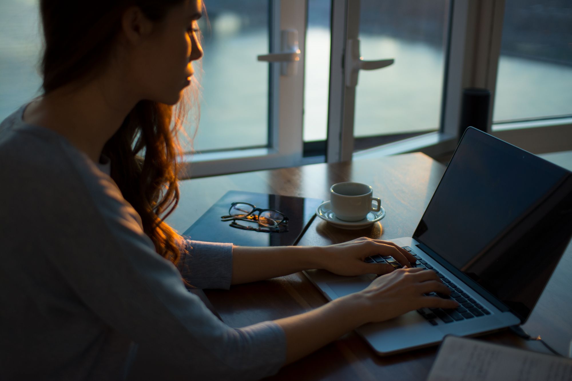 person typing on laptop