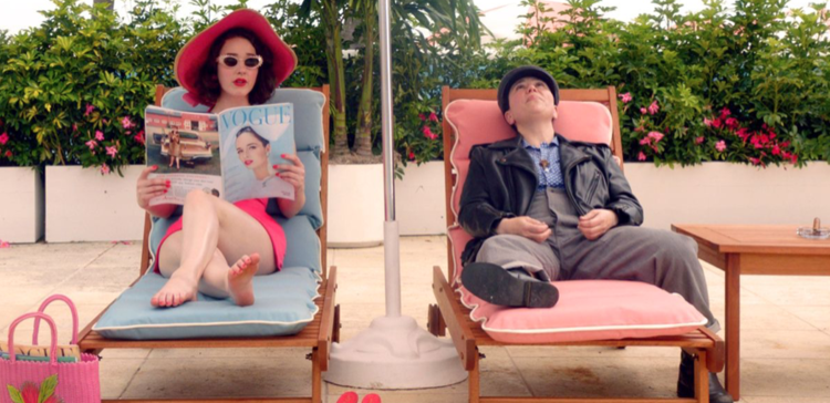 2 people at a pool resort