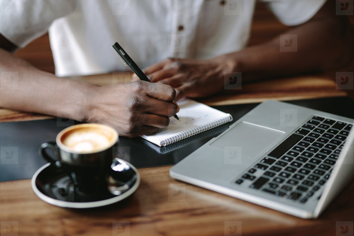 Person writing in a notebook